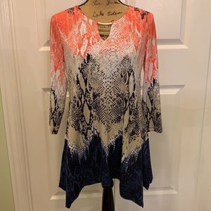 Fun studded top for leggings or pants.